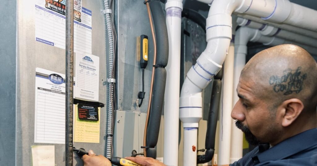 Technician inspecting a furnace condensate pump