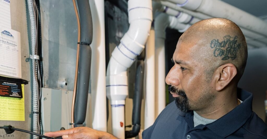 Air Pro technician inspecting a furnace not igniting