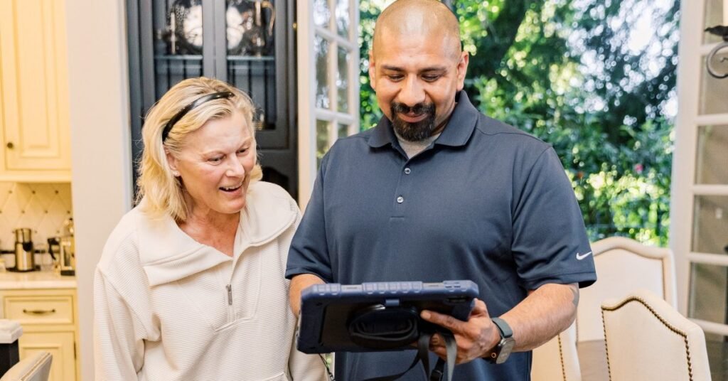 Technician and homeowner discussing furnace size